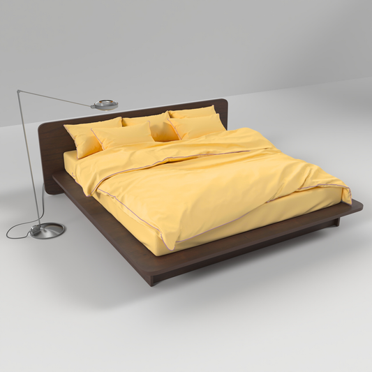Yellow cotton bedding set by BUTTIA with lavender piping, featuring a duvet cover, bed sheet and matching pillowcases.