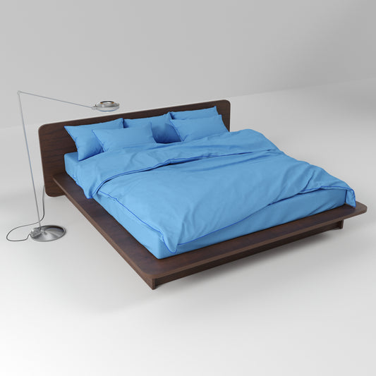 BUTTIA light blue bedding set featuring a soft duvet cover, bed sheet and pillowcases with contrast blue piping.