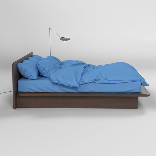Aesthetic blue bedding by BUTTIA featuring a full set with a blue-piped duvet cover and matching pillowcases.