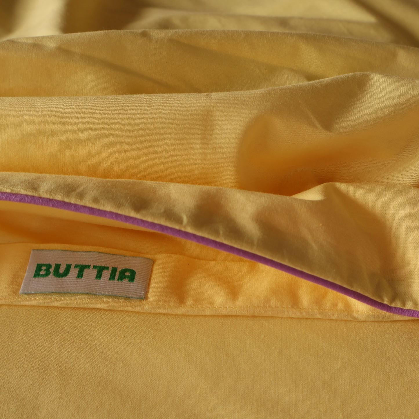 BUTTIA yellow cotton bedding detail.