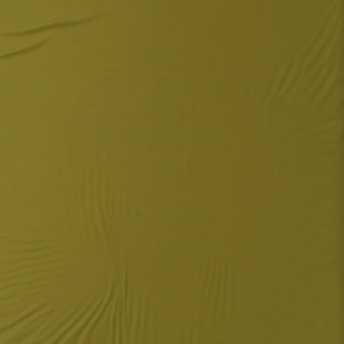 A close-up of olive green sheet with a soft, slightly wrinkled texture.