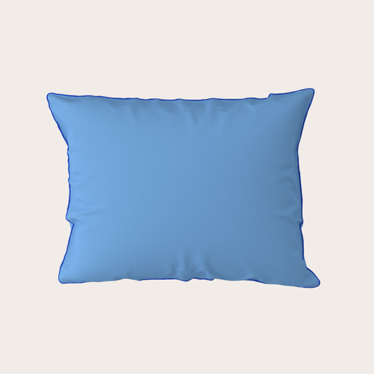 Blue pillow on a light gray background