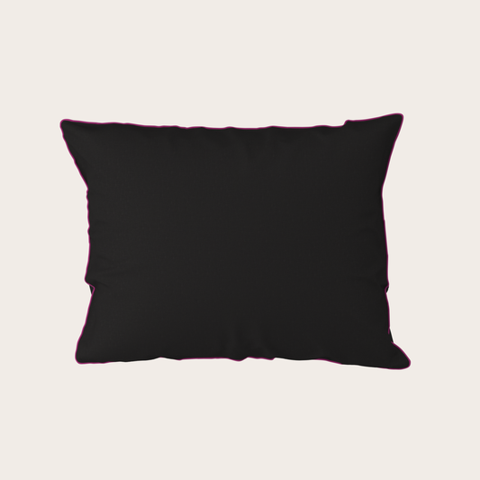 Black pillow on a light beige background