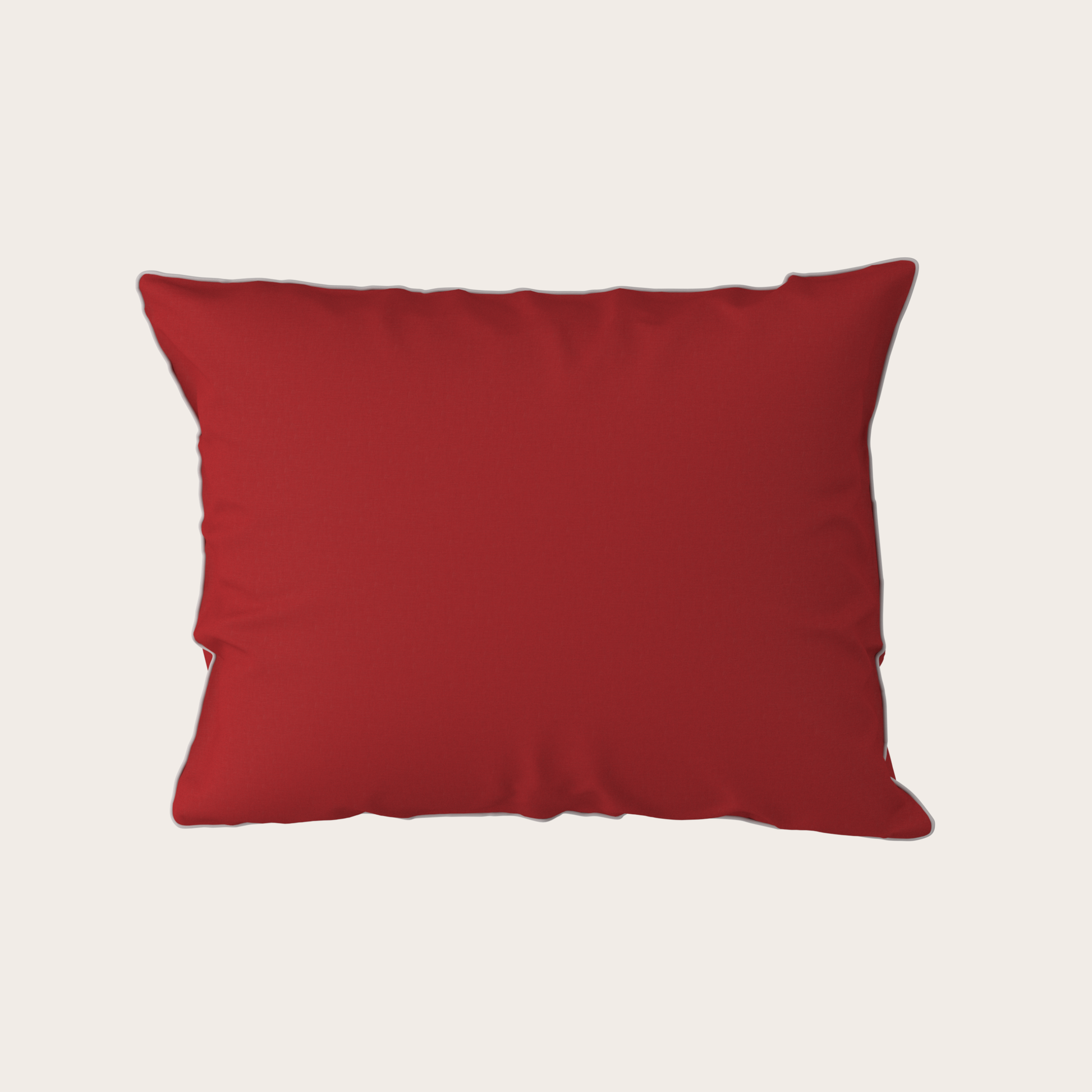 Red pillow on a light gray background