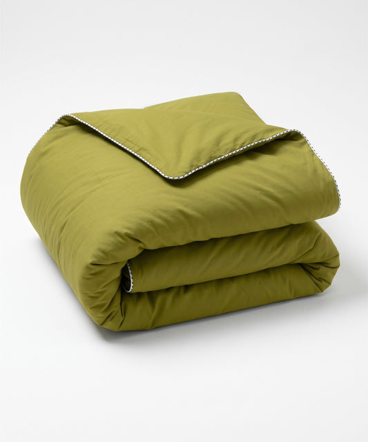 A folded olive green quilted comforter with a white and black dotted border trim, shown on a clean white background.