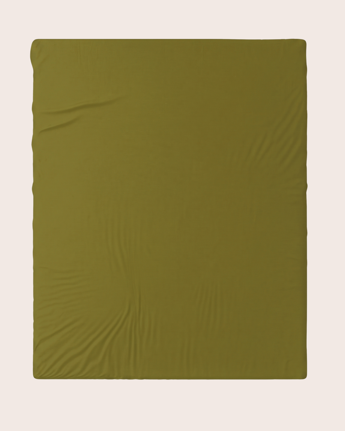 An olive green fitted sheet  laid flat against a light beige background.