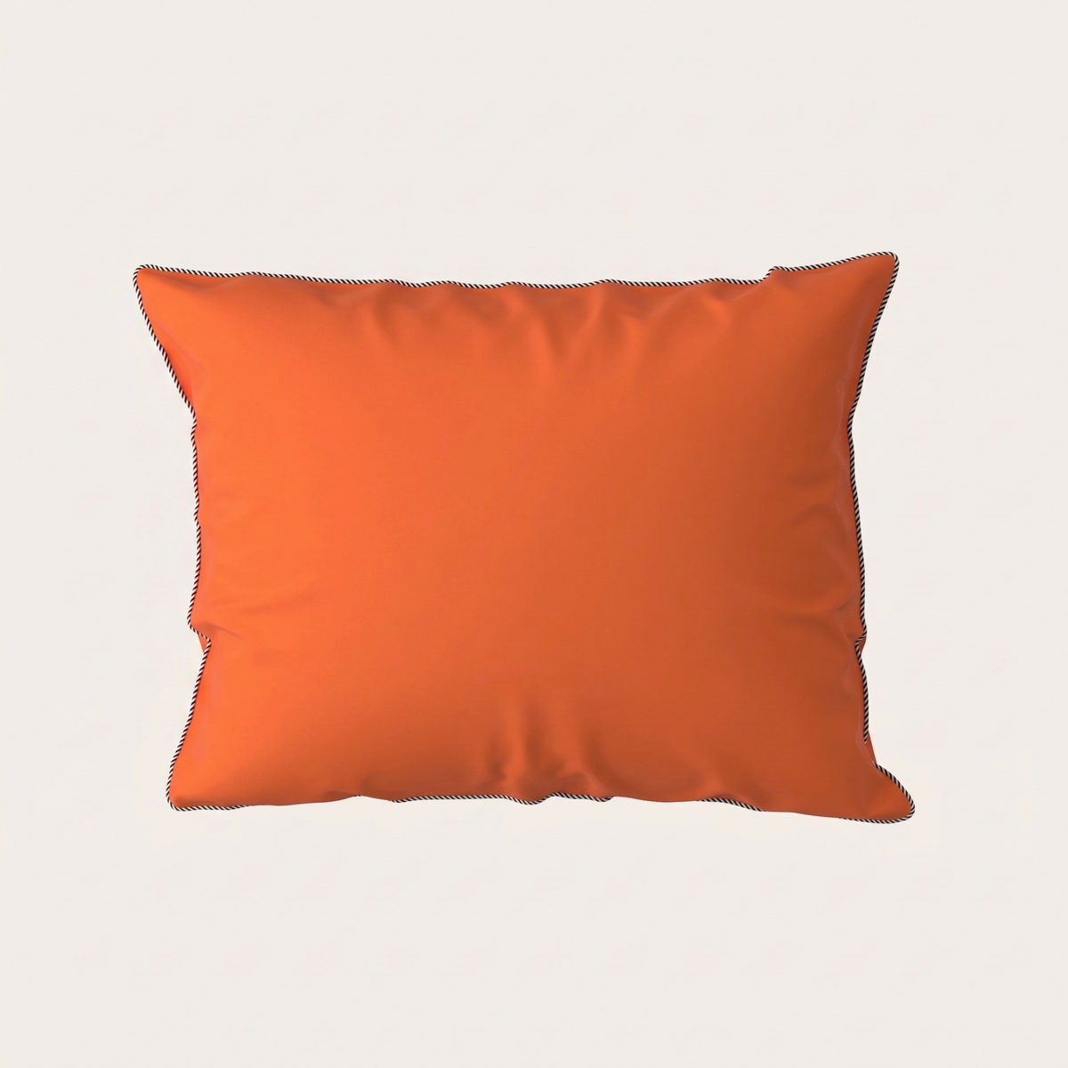 A rectangular orange throw pillow with dark contrast stitching, shown against a solid off-white background.